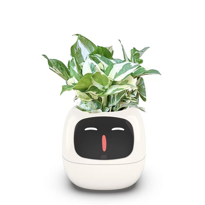 EMOKO smart pet planter robot with green leafy plant and digital face display in white casing