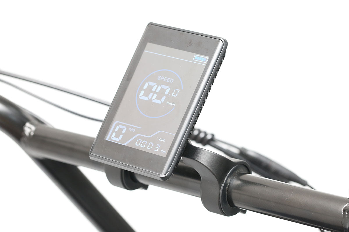 Emoko electric bike LCD display mounted on a black bicycle handlebar showing speed and other riding data