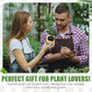 EMOKO smart pet planter robot held by woman as man takes notes in greenhouse for plant care