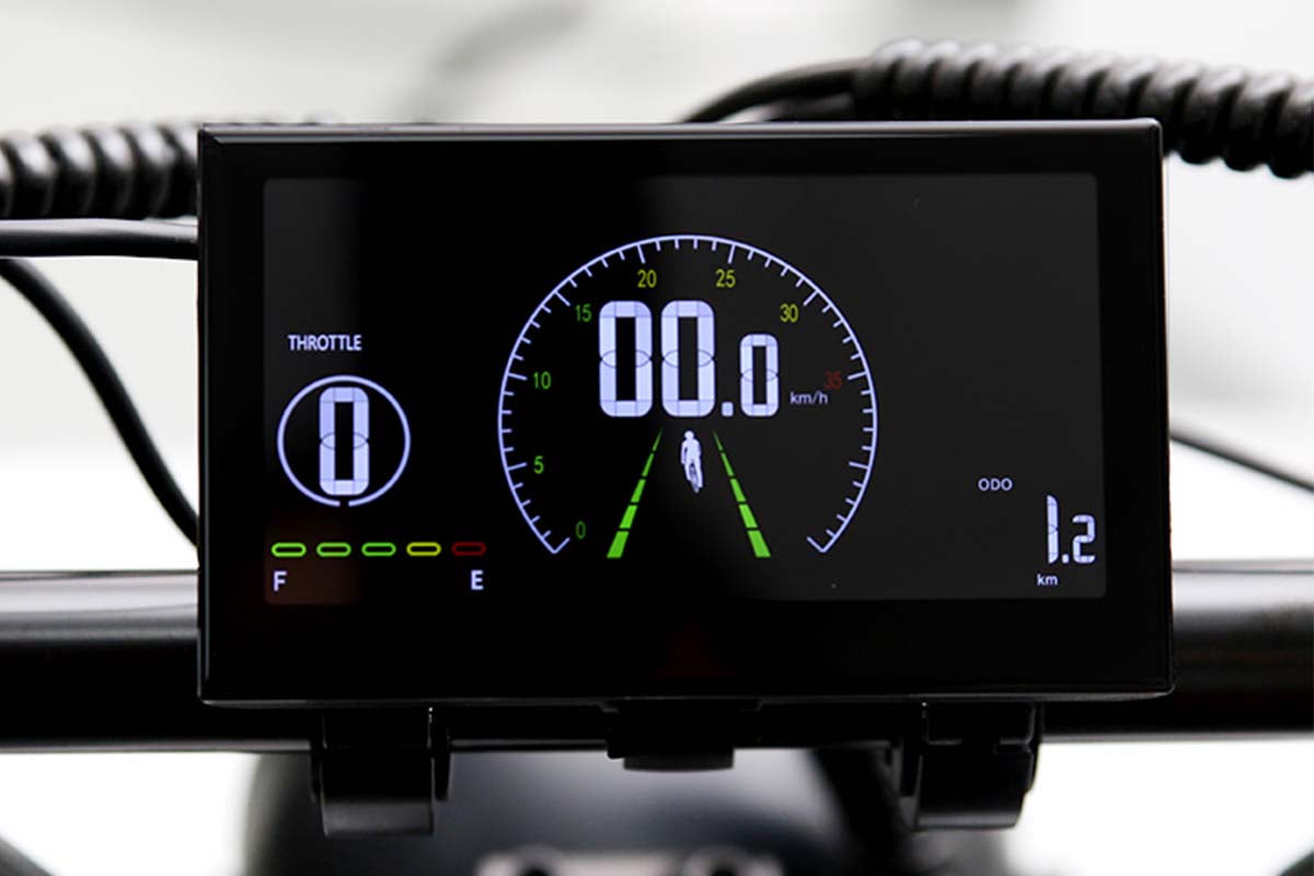 Emoko electric bike LCD display showing speed throttle and distance on a black screen