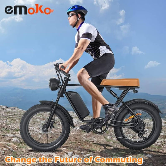 Emoko powerful electric commuter bike with fat tires and tan seat ridden by cyclist on rocky terrain